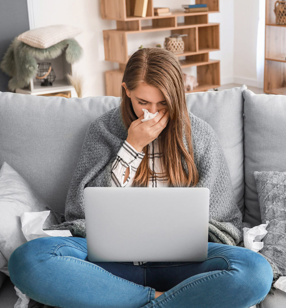 Young woman sneezing